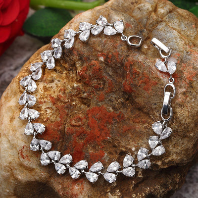 Sukkhi Dazzling Rhodium plated Pear shaped charm bracelet for women